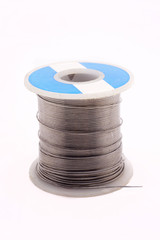 Spool of soldering alloy isolated on the white background