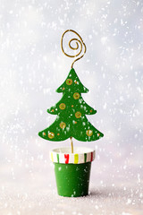 Christmas decoration with fir branches on the wood background.