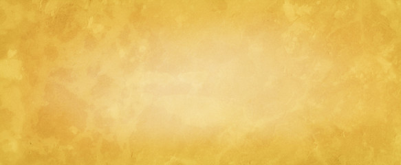 Abstract yellow background with soft bright center glowing with light beige and gold colors and dark border with old vintage grunge texture, parchment paper