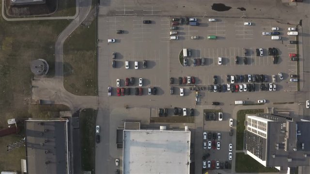 platform with parked cars at a multi-storey residential complex.