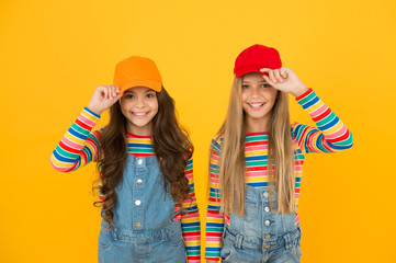 Modern fashion. Kids fashion. Girls long hair wear cap. Cute children wear cap snapback hat. Little...