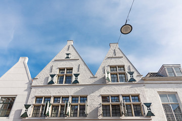 facade of white brick houses with shutters. Middelburg, The Netherlands