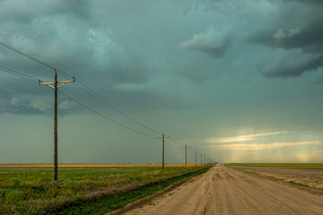 Fototapeta na wymiar Pathway leading to stormy skies in the distance