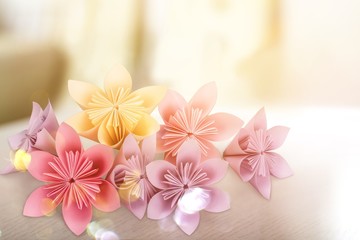 Fototapeta na wymiar Origami flowers on white background