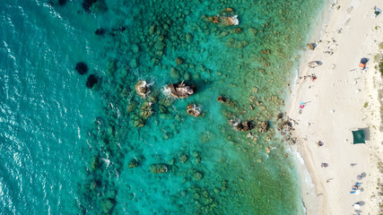 Aerial drone bird's eye view photo of tropical caribbean paradise rockybay with turquoise clear sea