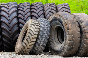 Fototapeta na wymiar Big tractor tires in outdoor in repair house