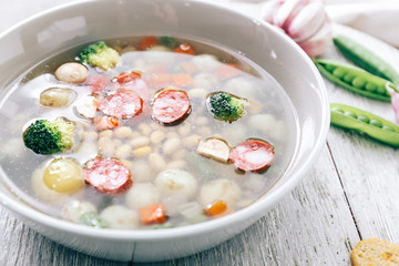 Tasty soup with legumes in bowl on table, closeup