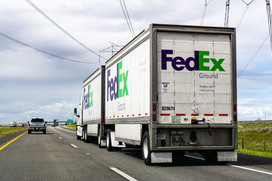 March 20, 2019  Buttonwillow / CA / USA - FedEx Ground truck driving on the interstate