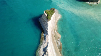 Aerial drone bird's eye view photo of iconic white rock volcanic formations of Canal d' Amour in...