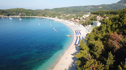 Fototapeta na wymiar Aerial drone photo of natural beauty bay and sandy beach of Valtos with watersports facilities and emerald sea. Parga, Epirus