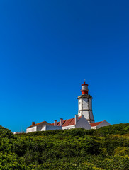 Fototapeta na wymiar Cape Espichel Lighthouse. Situated on the western coast of the civil parish of Castelo, municipality of Sesimbra, in the Setúbal district of Portugal