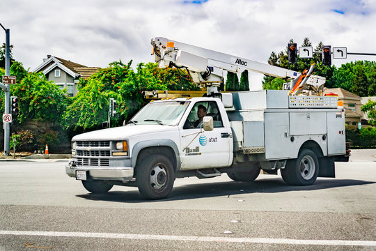 May 17, 2019 Sunnyvale / CA / USA - AT&T Service Truck Driving On A Street In A Residential Neighborhood; Emblem Displayed On The Side