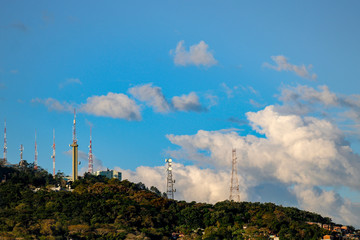 Florianopolis  Belas nuvens entre torres de transmissão do Morro da Cruz, Florianópolis, Brasil