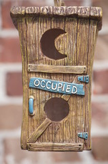 Cute birdhouse labeled occupied