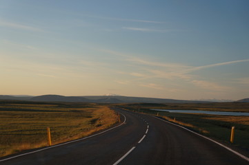 Obraz na płótnie Canvas Scenic shot of Iceland road at sunrise