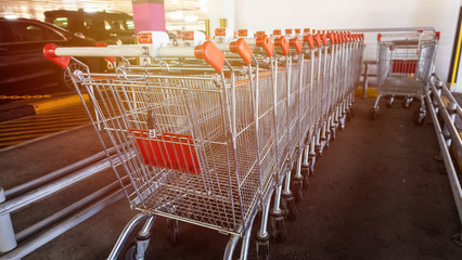 Row of shopping trolleys in the parking,