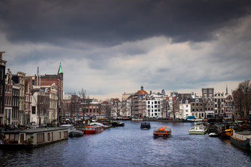 Amsterdam waterway with boats and buildings