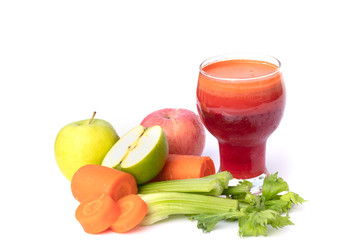 Fresh, healthy juice in a glass with carrots, apple and celery stalks, Vegetable juice isolate on white background