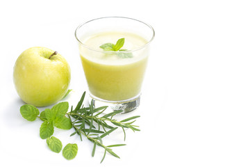Green apple juice in glass with mint leaf , rosemarry and fresh green apple isolate on white background,conept for health care dieting and herb