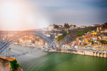 Porto Cityscape on the Douro River and Dom Luis I Bridge at Sunset.