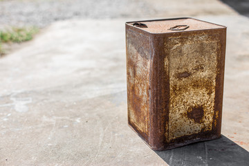 Rusted steel bucket  on concrete floor
