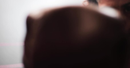 Female boxer punching to camera