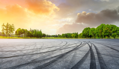 Empty race track and green woods nature landscape at sunset © ABCDstock