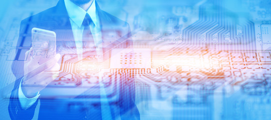 Double Exposure Man Holding Mobile Smart Phone against PCB mother board circuit technology background