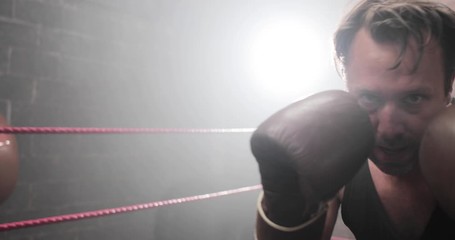 Male boxer punching to camera