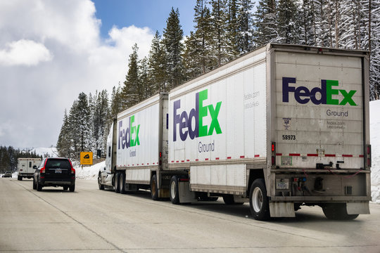 March 22, 2018 Truckee / CA / USA - Fedex Ground truck crossing the Sierra mountains from Nevada to California on the interstate