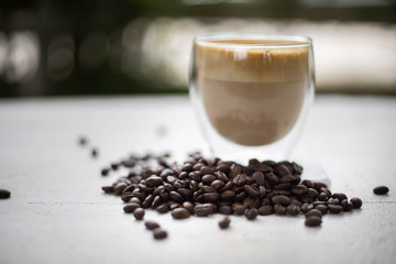 Coffee and coffee beans On the white table