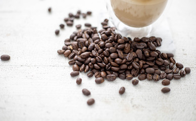 Coffee and coffee beans On the white table