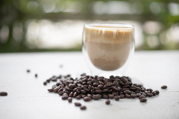 Coffee and coffee beans On the white table