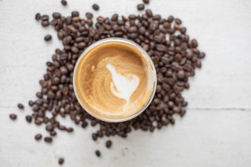 Coffee and coffee beans On the white table