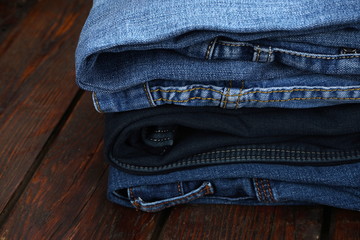 blue jeans on dark wooden background