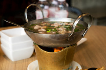 Boil spicy pork ball in Thai hot pot