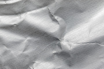Crumpled foil texture as background
