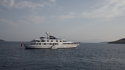 Naklejka na ściany i meble Yacht in the Bay of the Aegean sea.