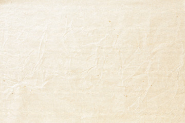 Old pale brown crumpled paper background texture