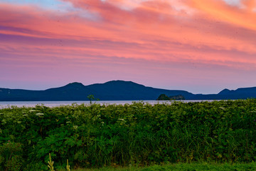 Naklejka premium Panoramic view of the city Petropavlovsk-Kamchatsky and volcanoes: Koryaksky Volcano, Avacha Volcano, Kozelsky Volcano. Russian Far East, Kamchatka Peninsula.