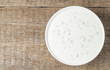 Tzatziki sauce made of yogurt, cucumbers, garlic and olive oil. National Greek cuisine. The view from the top. Copy space.
