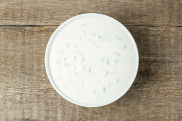 Tzatziki sauce made of yogurt, cucumbers, garlic and olive oil. National Greek cuisine. The view from the top. Copy space.