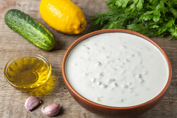 Tzatziki sauce made of yogurt, cucumbers, garlic and olive oil. National Greek cuisine. 