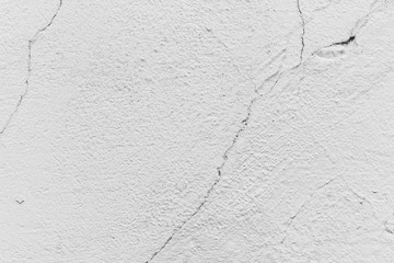 Texture of a concrete wall with cracks and scratches which can be used as a background