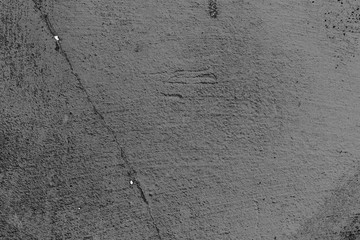 Texture of a concrete wall with cracks and scratches which can be used as a background