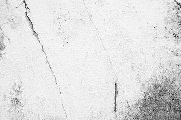 Texture of a concrete wall with cracks and scratches which can be used as a background