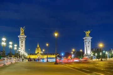 Paris France city skyline night at Seine River with Pont Alexandre III bridge
