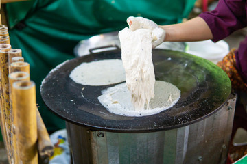 Make the dough on a large hot pan. traditional food in Ayutthaya thailand.