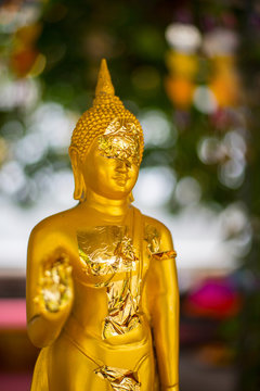 The golden Buddha image symbolizes