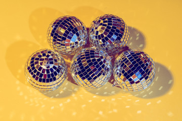  disco ball concept. Isolated on yellow background